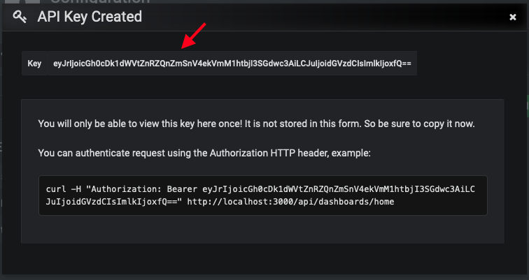 Grafana UI displaying a generated API key